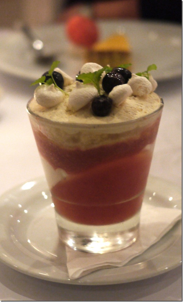 Fruit trifle with strawberries jelly, blue berries and meringue topping