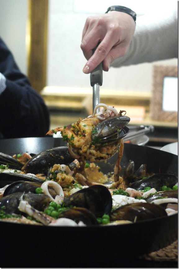 Seafood paella with prawns, black mussels, squid and blue swimmer crab