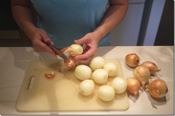 Peeling brown onions for French onion soup