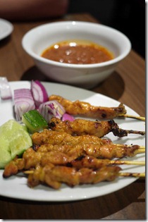 Chicken satays from a charcoal grill