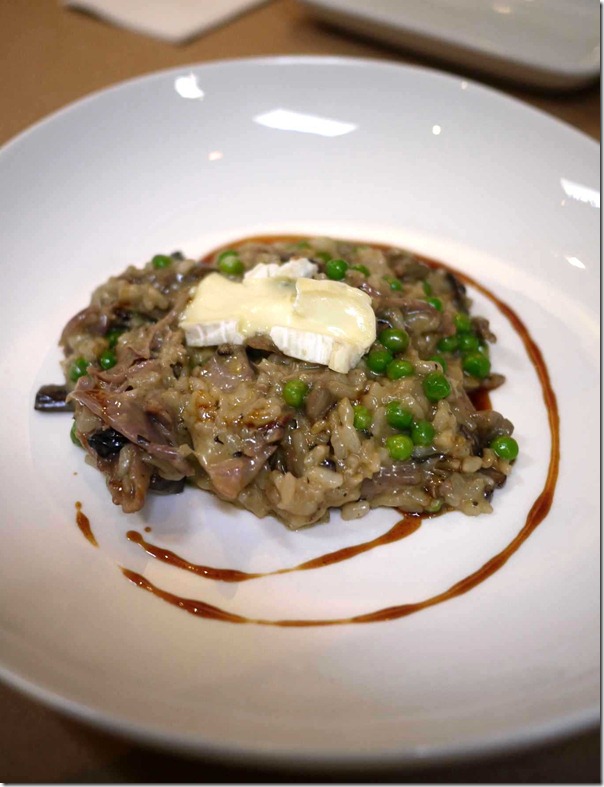 Mushroom and pea risotto with duck confit and triple cream brie $31
