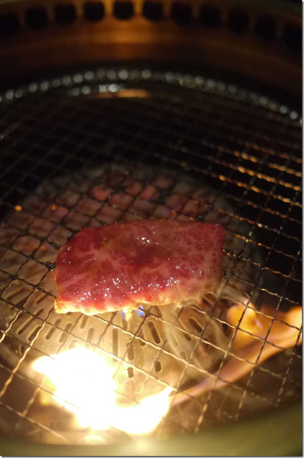 Fat from the wagyu beef caramelizing in the fire