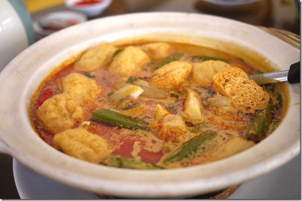 Curry fish head with deep fried tofu puffs and okra