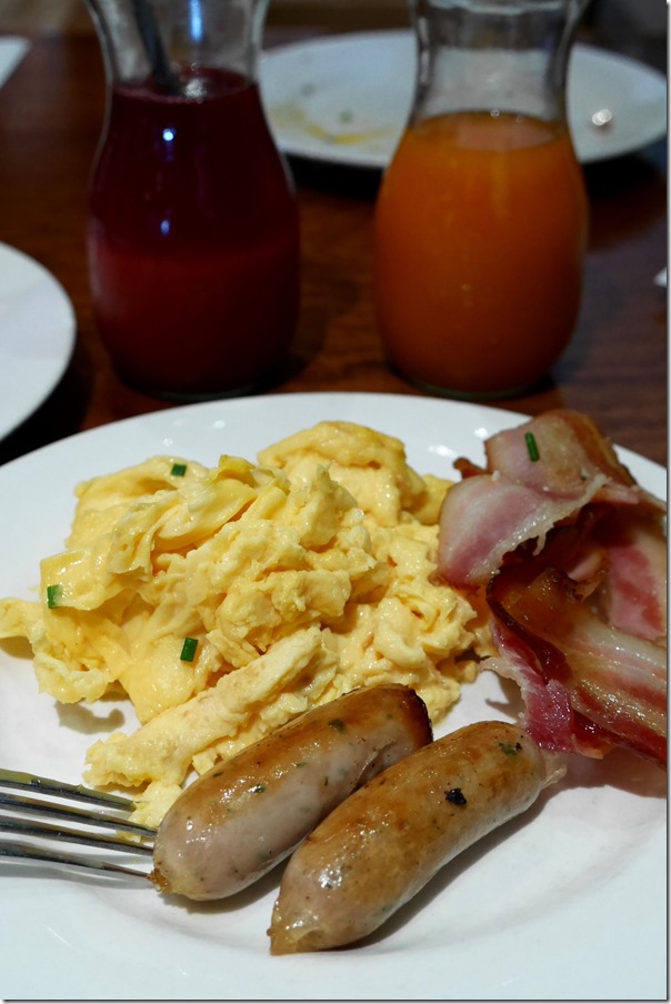 Streaky bacon, scrambled eggs and sausages
