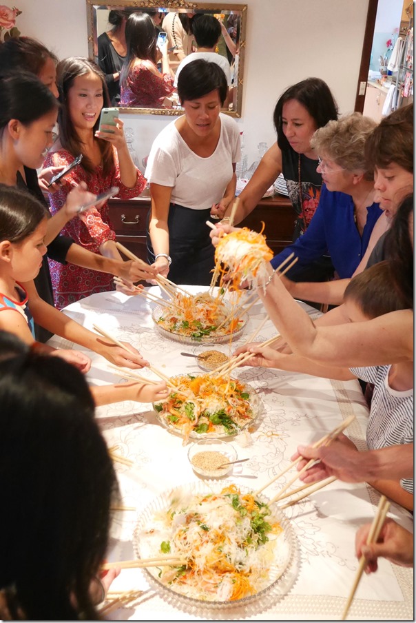 Tossing yee sang at Molly & KC's Chinese New Year feast 2015