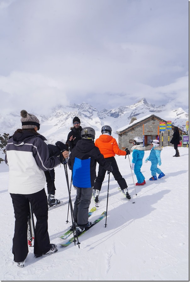 Snow skiers taking ski lessons at Gronergrat